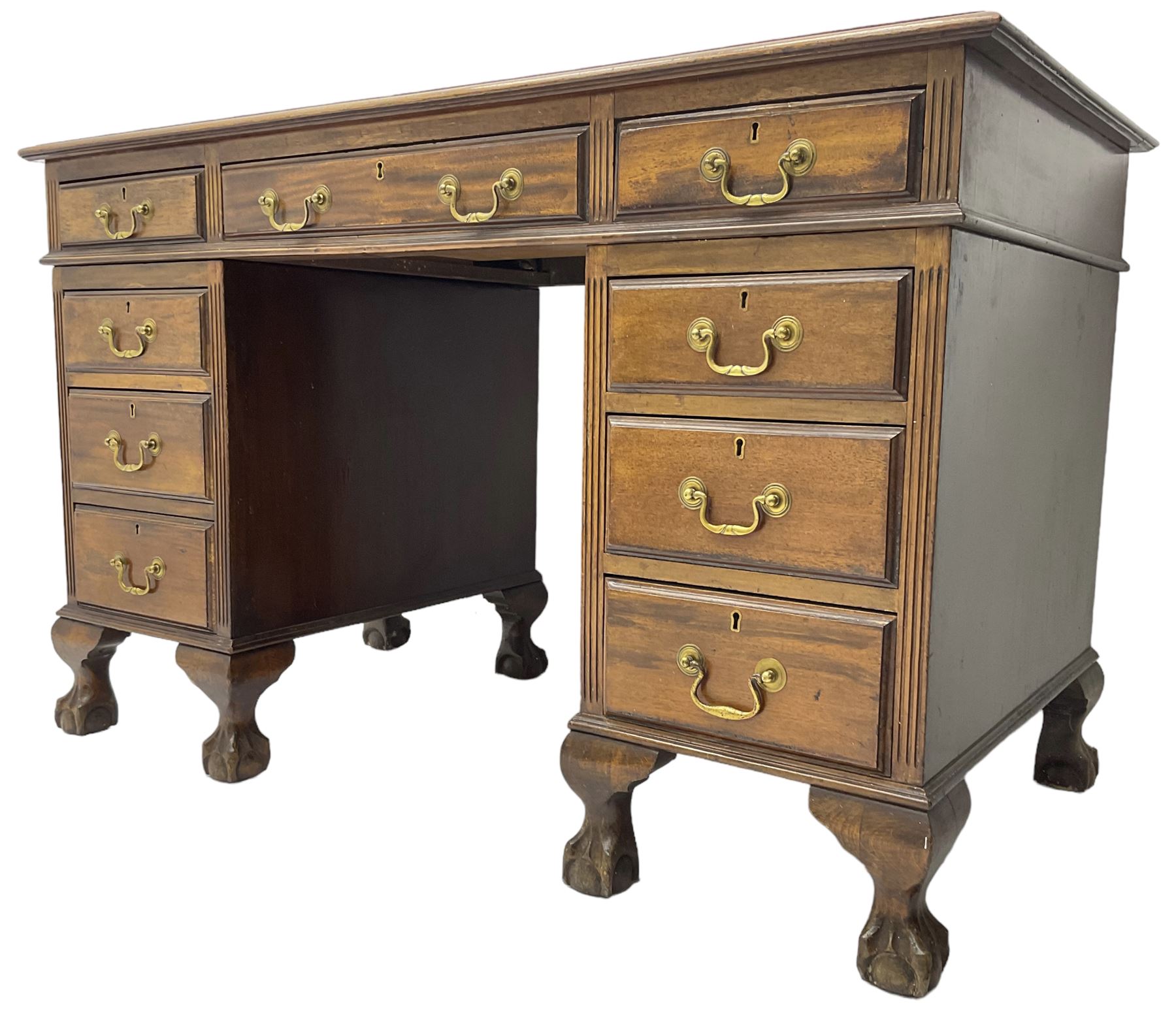 Early 20th century mahogany twin pedestal desk, fitted with nine drawers, on ball and claw carved cabriole feet