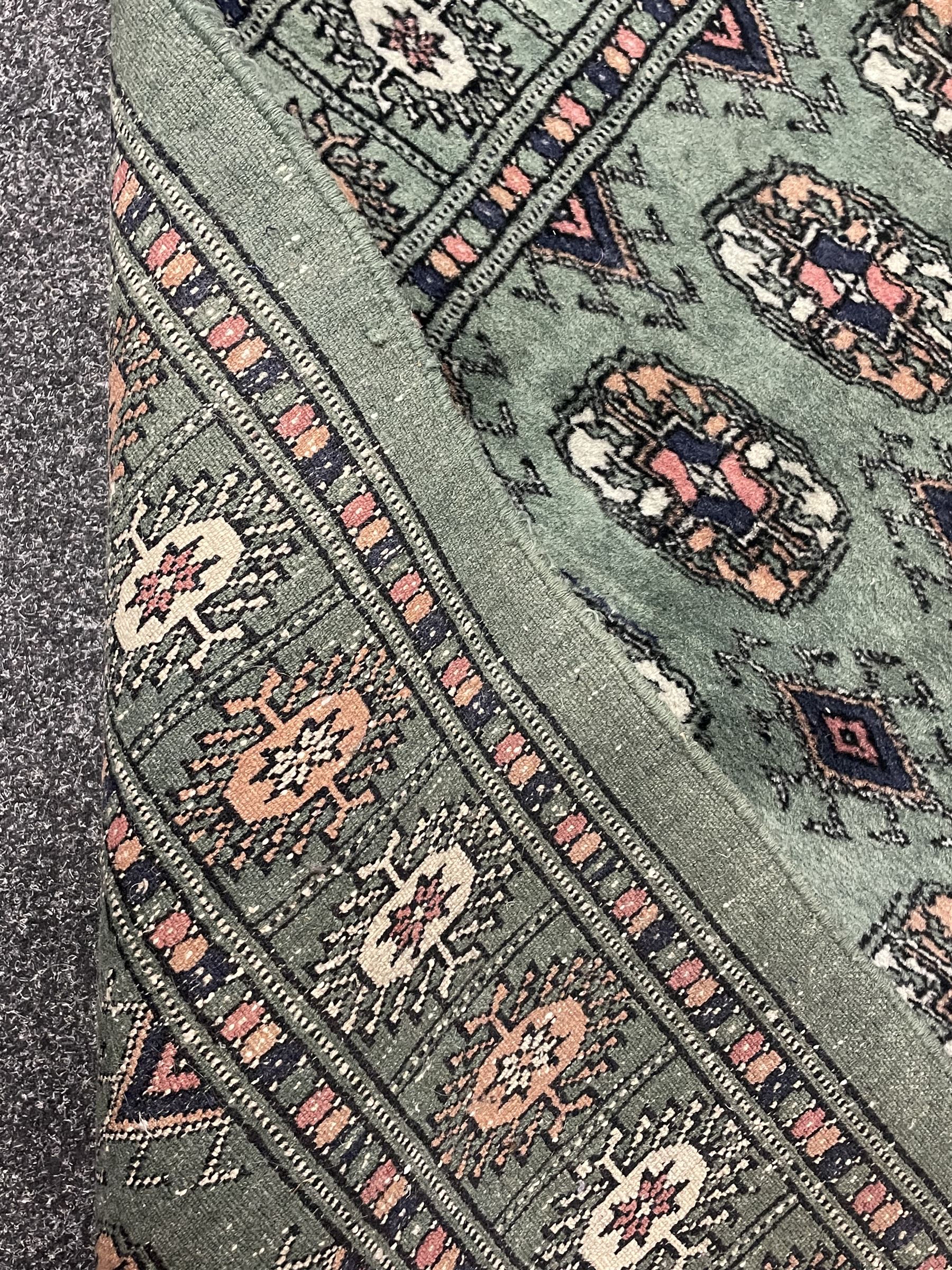 Persian Tekke Bokhara green ground runner rug 