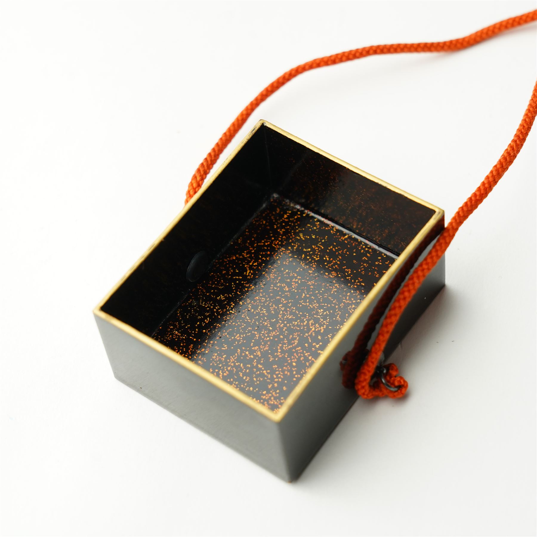 Japanese Meiji period lacquerware box with maki-e decoration, decorated centrally with the Chrysanthemum Seal, each side with trailing foliate decoration, the internal body with nashiji lacquer, with note reading 'From Prince Fushimi [Sadanaru] of Japan - May 1907', 5.5cm x 4.5cm
Provenance: Prince Sadanaru Fushimi of Japan visited London in May 1907, to be made an Honorary Member of the Military Division of the First Class by King Edward VII. The great-uncle of the vendor, by repute, worked in the Royal Household at this time, starting at age 15. It is unclear how he came to acquire the item, however it is known that he worked closely with Edward VIII. He would serve the family until his retirement, where he would be granted a grace-and-favour home on the Sandringham estate. Lot 6009, the cigarette case, is also property of the same vendor. 