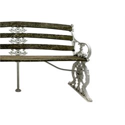 Late 19th century white painted cast iron and wood slatted garden bench, the bench ends in the form of S-scroll mythical beasts with paw feet, central cartouche surrounded by extending trailing foliage, the back slats divided by scroll cast splats, central seat support 