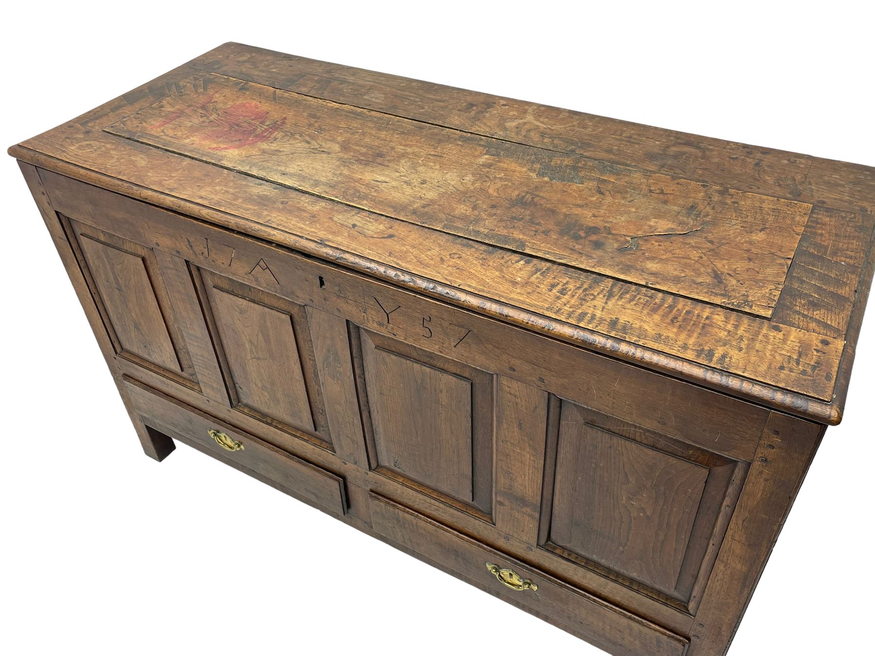 Georgian oak mule chest, moulded rectangular hinged lid over quadruple fielded panel front, the frieze inscribed '17 A Y 57', fitted with two drawers, panelled ends and back, on stile supports