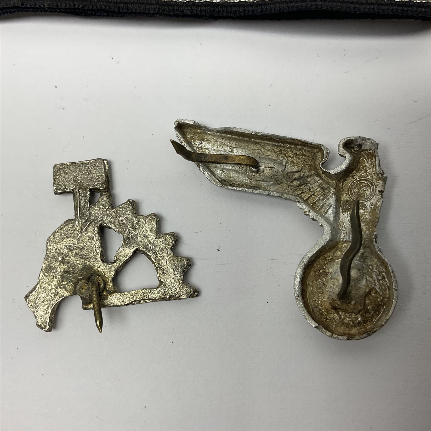 Three Reichsfuhrer 'SS' cuff titles; RZM 'SS' paper tag; German Water Police belt buckle; Destroyers badge marked RKS verso; N.S.B.O. lapel badge; and incomplete party eagle cap badge (8)