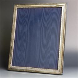 Late 20th century silver photograph frame, rectangular with beaded decoration to inner edge, blue velvet easel style support verso, hallmarked Carrs of Sheffield Ltd, Sheffield 1995