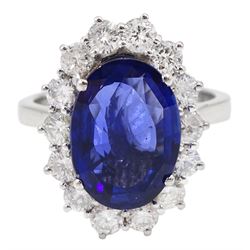 18ct white gold oval fine Ceylon sapphire and round brilliant cut diamond cluster ring, hallmarked, sapphire approx 4.00 carat, total diamond weight approx 0.90 carat