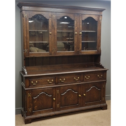  Traditional oak dresser, projecting cornice, three stepped arched glazed doors enclosing three shelves, above three drawers and panelled cupboard doors, bracket feet, W169cm, H203cm, D46cm  