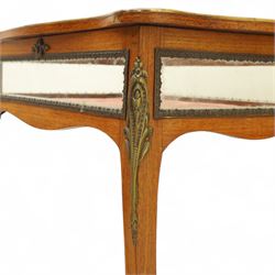 Louis XV revival style walnut bijouterie table, rectangular serpentine form, with brass edging and a hinged floral marquetry inlaid lid with bevelled glass top and sides, gilt-bronze beaded border, interior lined with rich red velvet, raised on slender cabriole legs with gilt bronze masks and sabots, circa 1900