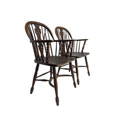 Pair late 20th century oak Windsor elbow chairs, double hoop and stick back with pierced and fretwork work splat, dished seat on turned supports joined by crinoline stretcher