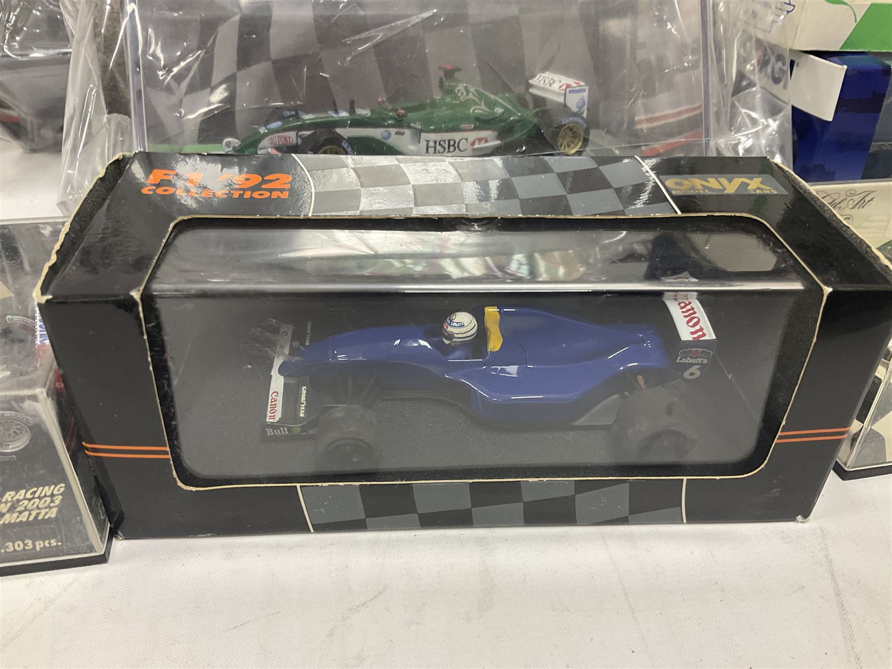 Panini Formula 1 The Car Collection - twelve die-cast models including ten in unopened packaging with periodical; all models in plastic display boxes; and eight other boxed die-cast models of racing cars by Corgi, Onyx, Classico, Minichamps etc (20)