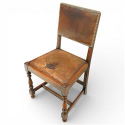 Early 20th century four oak side chairs, with studded leather upholstered backs and seats, on square section legs with baluster turned front supports and straight stretchers