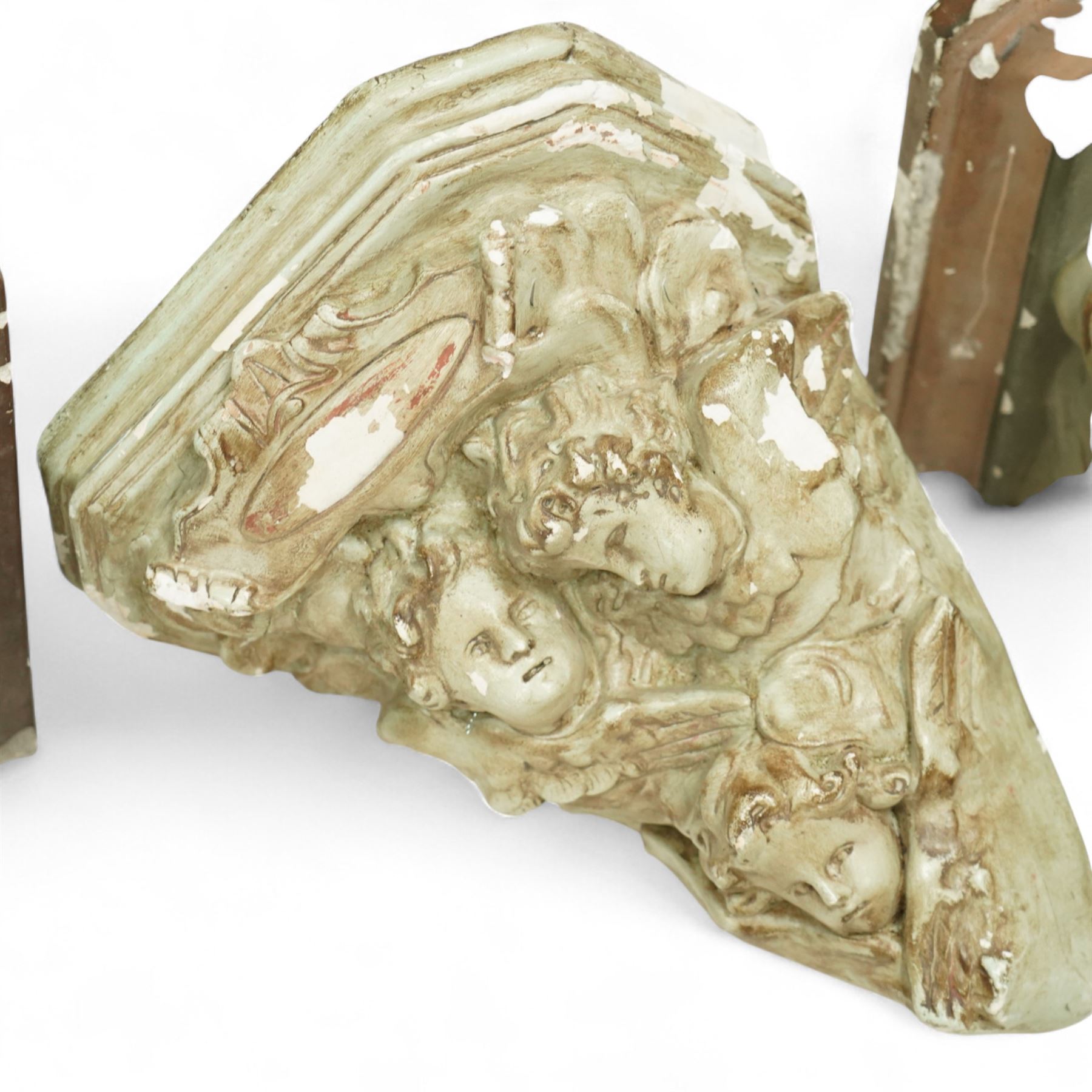 Set of three Belgian wall cornices, each with moulded shelf top above polychrome painted cherubic and rococo scroll ornament

Pale green (H 43cm, D 42cm, W 39cm)
Painted cherubs (H 51cm, D 47cm, W 49cm)
Darker green (H 46cm, D 42cm, W 50cm)