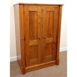 French walnut double wardrobe, two doors enclosing fitted interior flanking by two columns, plinth base, W99cm, H151cm, D65cm  