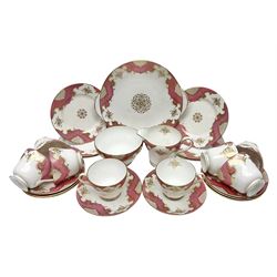 Shelley Classic pattern tea service for six, decorated with borders of pink and gilt foliate design on plain white ground, pattern no 14077, comprising eight saucers, six tea plates, cake plate, eight teacups, bowl and jug, all with printed marks beneath