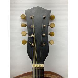 Early 20th century Italian Rafaele Disantino eight-string mandolin with two-piece back and spruce top with stamped Rafaele Disantino signature; bears maker's label L61cm; in wooden carrying case