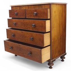 Victorian flamed mahogany chest, fitted with two short and three long drawers, turned wooden handles, raised on bun feet