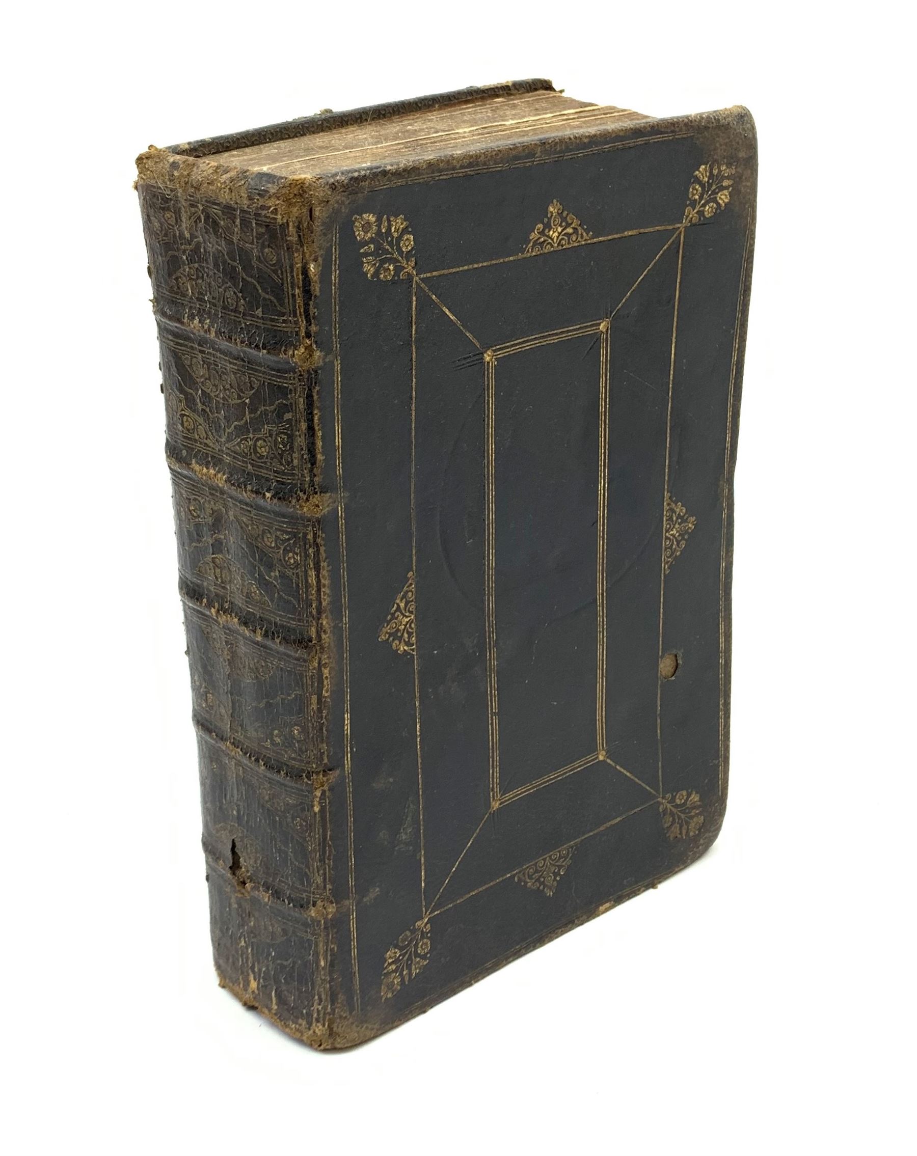 Early 18th century Holy Bible. 1711. London. Printed by The Assigns of Thomas Newcomb and Henry Hills, deceas'd. Printers to the Queens Most Excellent Majesty. Engraved title page. Red lined pages. Full tooled leather/gilt binding with aeg.