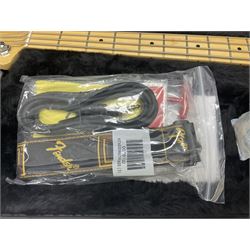 Fender Precision Bass guitar, in Olympic White finish with tortoiseshell effect scratchboard, serial no US15103092, in black Fender hard case with Fender strap and warranty card, guitar L116cm