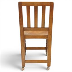 Mouseman - 1940s oak side chair, the slat-back over a slung leather seat, raised on octagonal front supports united by box stretcher, carved with slim mouse signature, by the workshop of Robert Thompson of Kilburn