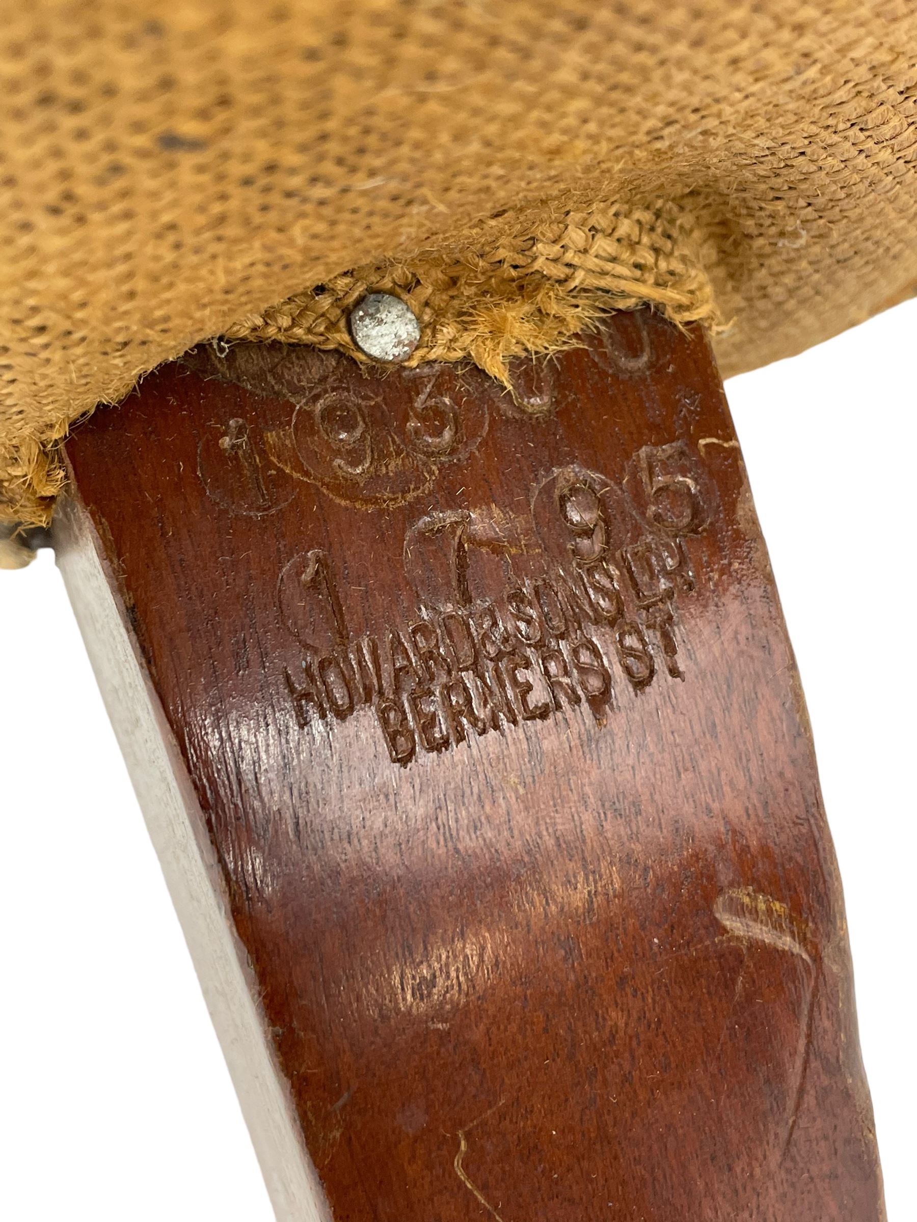 Howard & Sons - Edwardian mahogany framed two seat sofa, upholstered in original H&S foliate patterned fabric with sprung seat and overstuffed back and arms, raised on square tapering supports, the rear leg stamped '19600 1795 Howard & Sons Ltd Berners Street'
