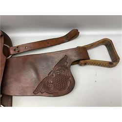 Western Saddle, with floral tooled leather decoration and sheep skin lined, complete with stirrups, L60cm 