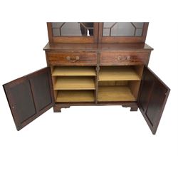 Acorn Industries - Georgian design mahogany bookcase on cupboard, fitted with two astragal glazed doors enclosing three glass shelves, base with two cock-beaded drawers over two panelled cupboards, inlaid with acorn signature, by Alan Grainger, Brandsby