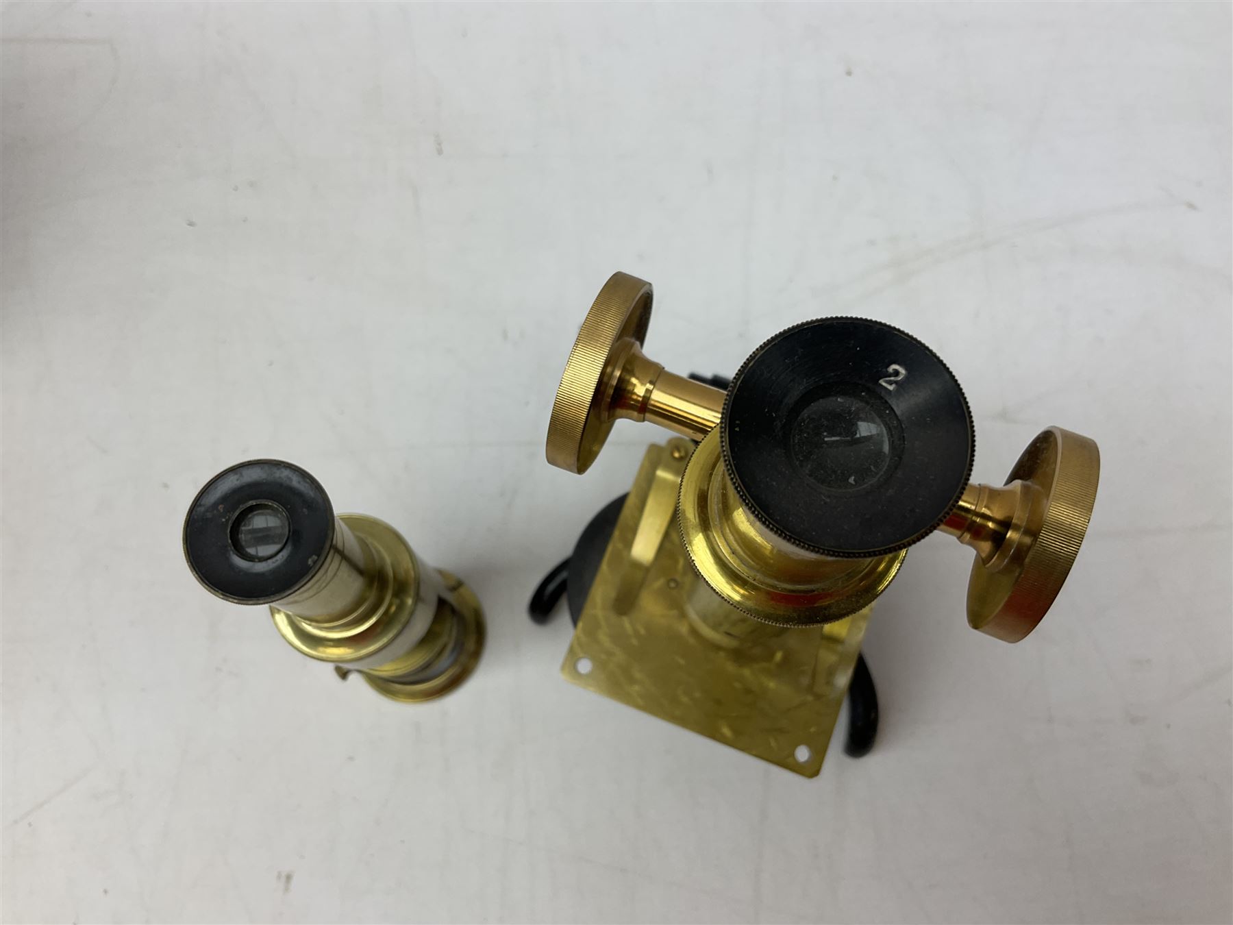  Brass field microscope, together with a cased microscope and twenty five microscope slides