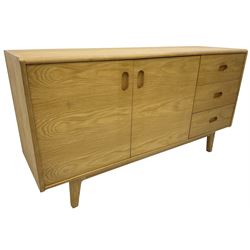 Contemporary light oak sideboard, fitted with double cupboard and three drawers, on tapering supports
