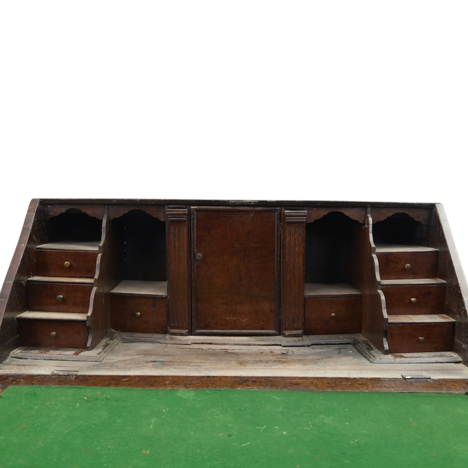 18th century inlaid oak bureau, the fall-front with central star inlay enclosing fitted interior with central cupboard flanked by fluted column correspondence drawers and pigeon holes, over two short and three long drawers, lower moulded edge on bracket feet