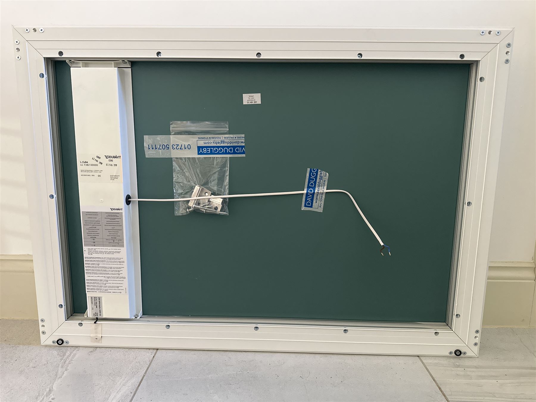 Villeroy & Boch vanity unit, ceramic hand basin with Hansgrohe mixer tap on two drawer wall mounted unit in gloss grey finish L101cm D47cm H58cm. Complete with Duravit illuminated wall mounted mirror in white frame 100cm x 70cm