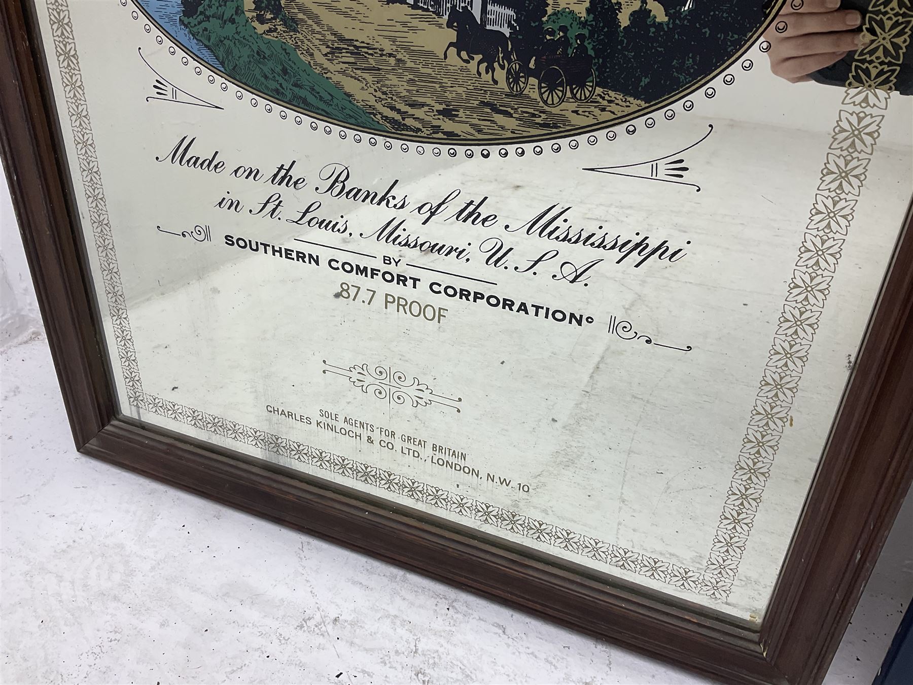 Southern Comfort advertising mirror, together with a framed star sign print, mirror H90cm