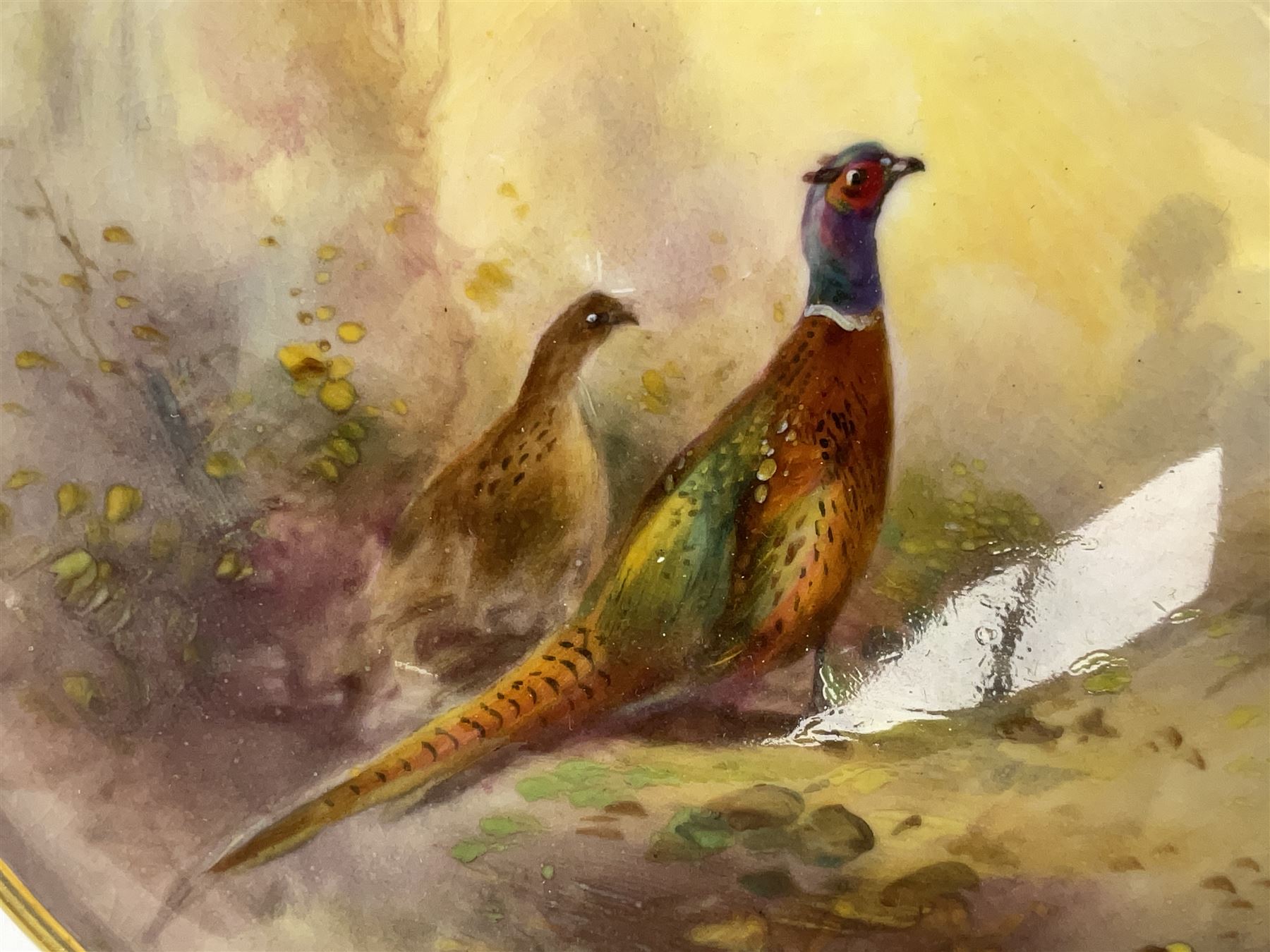 1938 Royal Worcester circular pedestal pin dish, decorated with pheasants in a landscape by James Stinton, with printed mark beneath, D10.5cm