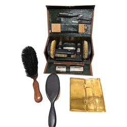 Gentleman's vanity set, containing ebony brushes, chrome jars and bottles, within fitted leather carrycase, together with two other similar brushes 