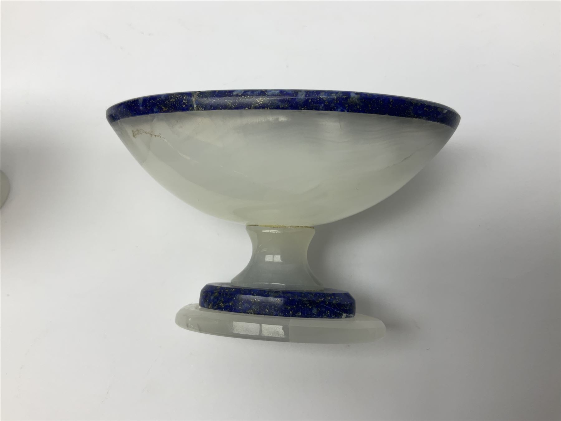 Pair of lapis lazuli and agate open salts, of navette form, upon a stepped oval pedestal foot, H5cm, L8cm