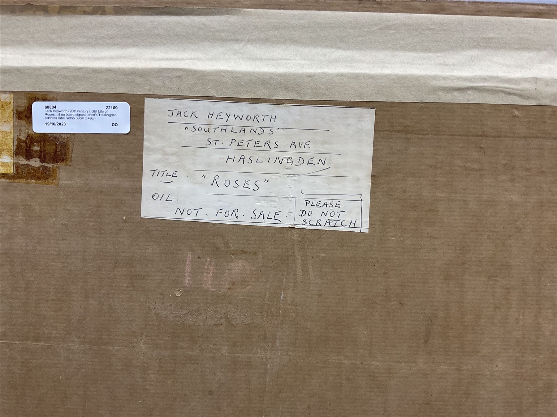 Jack Heyworth (20th century): Still Life of Roses, oil on board signed, artist's 'Haslingden' address label verso 39cm x 49cm