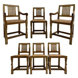 Rabbitman - set of six (4+2) oak dining chairs, carved and pierced lattice back, tan leather upholstered seat with stud band, on octagonal supports united by H-stretchers, carved with rabbit signature, by Peter Heap, Wetwang 