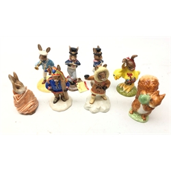  Six Bunnykins boxed figures comprising Easter Parade, Eskimo, Little Boy Blue, two Hornpiper and Winter Lapland and two Beswick Beatrix Potter figures Squirrel Nutkin and Poorly Peter Rabbit (8)  
