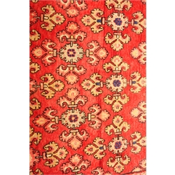  Persian red ground rug, repeating field and border 325cm x 170cm  
