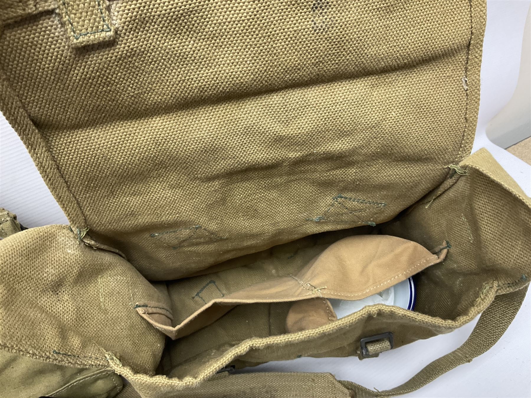 Two post-WWII British Army No.2 Dress tunics, one with Green Howards buttons; army shirt dated 1951; Royal Fleet Auxilliary jacket with trousers; three RAF/WAAF uniforms and RAF Greatcoat; and three canvas/webbing bags, two dated 1943 & 1945