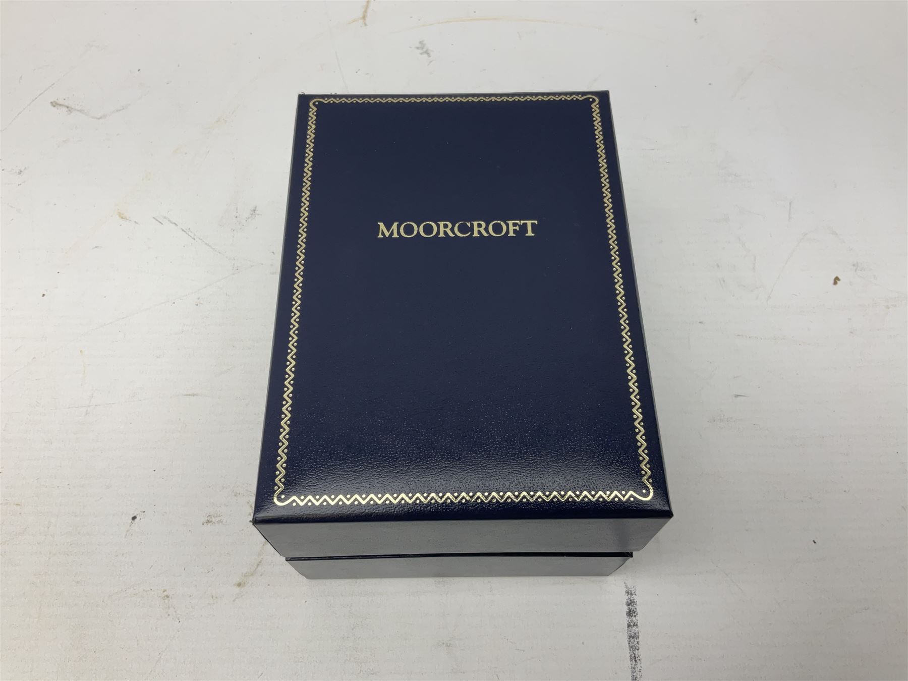 Limited edition Moorcroft enamel vase, decorated in the Lundy Island pattern, with certificate signed by the artists, no 58/75, in fitted box