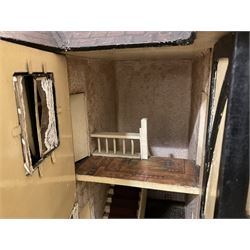 Large Tri-ang No.93 doll`s house in the 'Stockbroker's Range' c1935; two-storey double-fronted Tudor design, half timbered gables, two-storey bay windows, cream and mock shrubbery to front, opening metal framed windows with green shutters, red simulated tiled roof with chimney, integral garage with opening doors, front elevation has four hinged doors opening to reveal two bedrooms with fire places, living room, bathroom and kitchen with built in dresser and sink, entrance hall and staircase, side entrance with porch and seat and sun dial over on chimney stack; some wiring for electrical lighting; metal Tri-ang Toys disc verso; comprehensively furnished H66cm L117cm D43cm