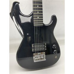 Encore black electric cut-away guitar L96cm; and Spanish Victor Garcia model 187 acoustic guitar, bears label dated 1972 L99cm; each in soft carrying case (2)