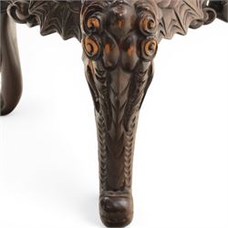 Chinese carved hardwood dragon throne chair, the shaped and pierced back with entwined dragons and cloud motifs, sweeping dragon-form arms terminating in carved heads, solid panel seat over foliate carved apron, on four mask carved cabriole supports