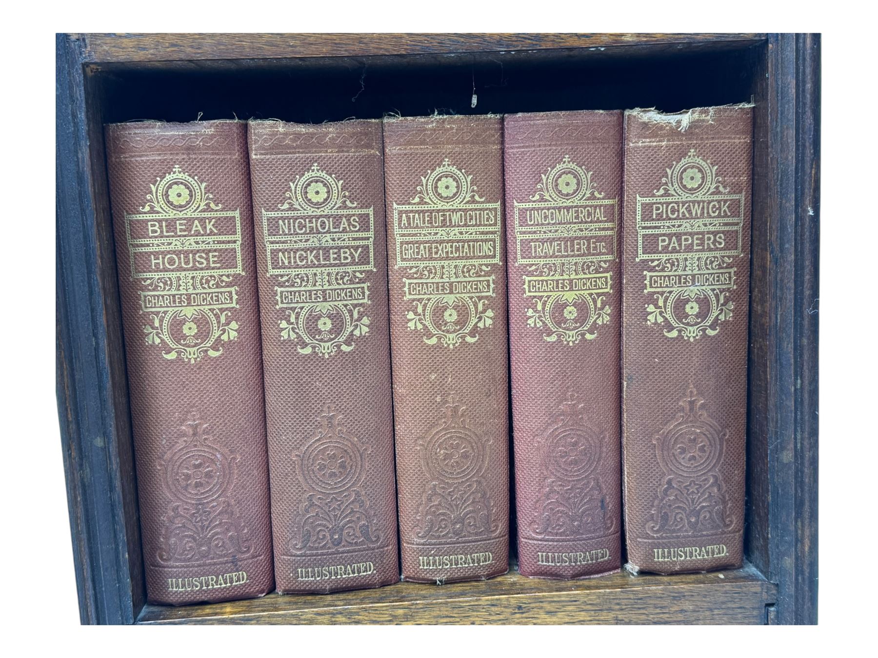 20th century oak barley twist gateleg table (W78cm); early 20th century narrow oak bookcase with Charles Dickens novels (W31cm, H93cm) 