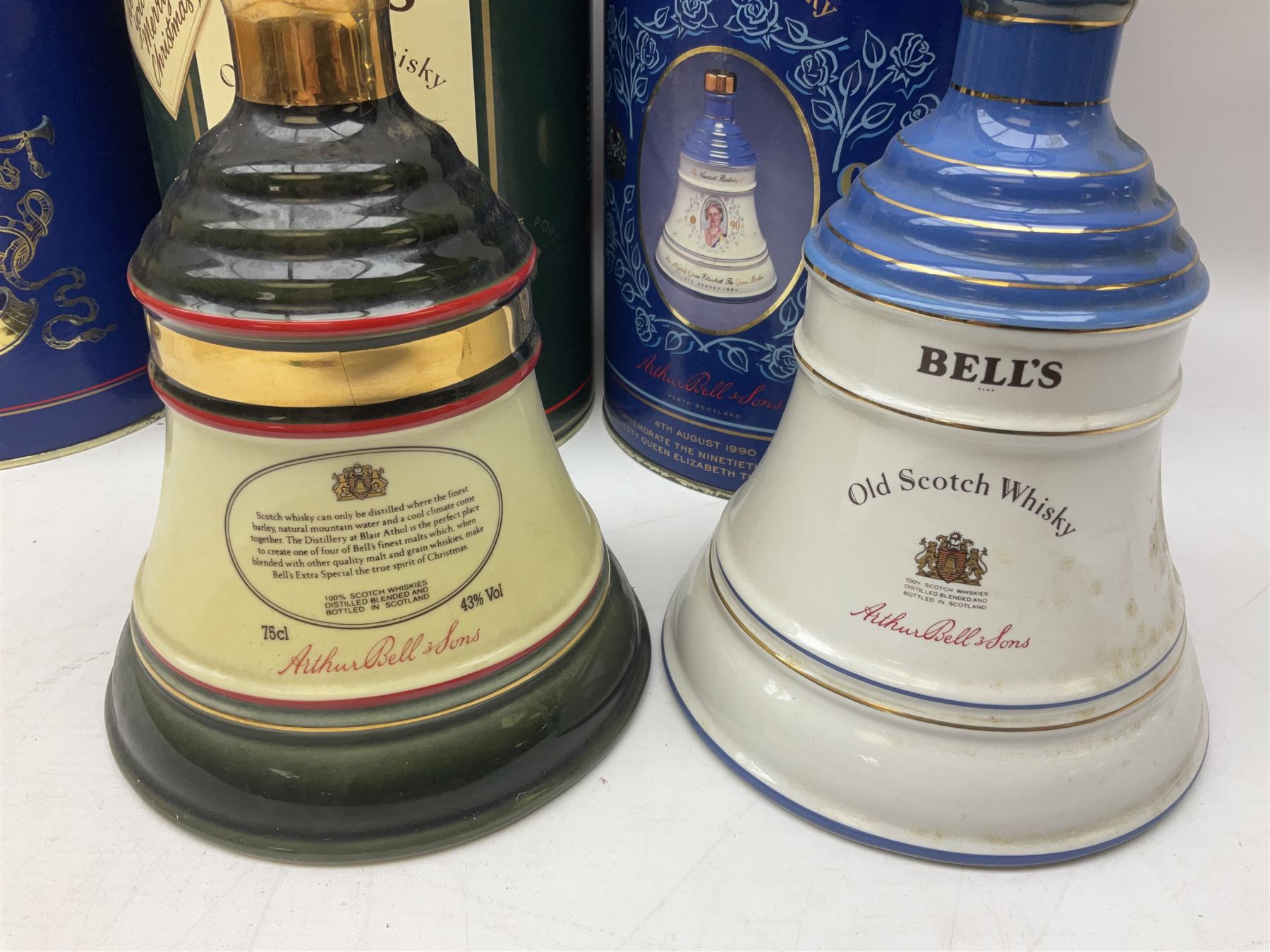 Bells, Scotch whisky, in seven Wade ceramic decanters, comprising two Christmas decanters 1990 and 1991, 60th birthday of Queen Elizabeth II decanter, Golden Wedding anniversary of the Queen and the Duke of Edinburgh decanter, Birth of Princess Beatrice decanter, Birth of Princess Eugenie decanter and Queen's mothers, together with Bells, blended Scotch whiskies, three miniatures in Wade ceramic decanters, various contents and proofs