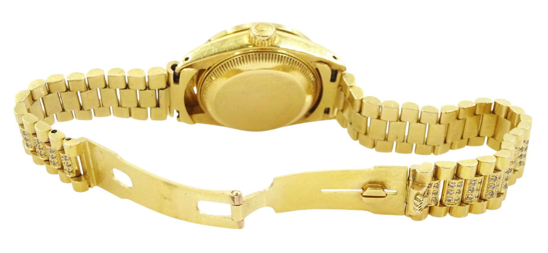 Rolex Oyster Perpetual Datejust ladies 18ct gold automatic wristwatch, circa 1983, Ref. 69178, serial No. 8058240, champagne dial diamond dot hour markers and outer diamond ring, after market diamond set bezel and lugs, on 18ct gold President bracelet, set with after market diamonds, with AIGL report and additional links