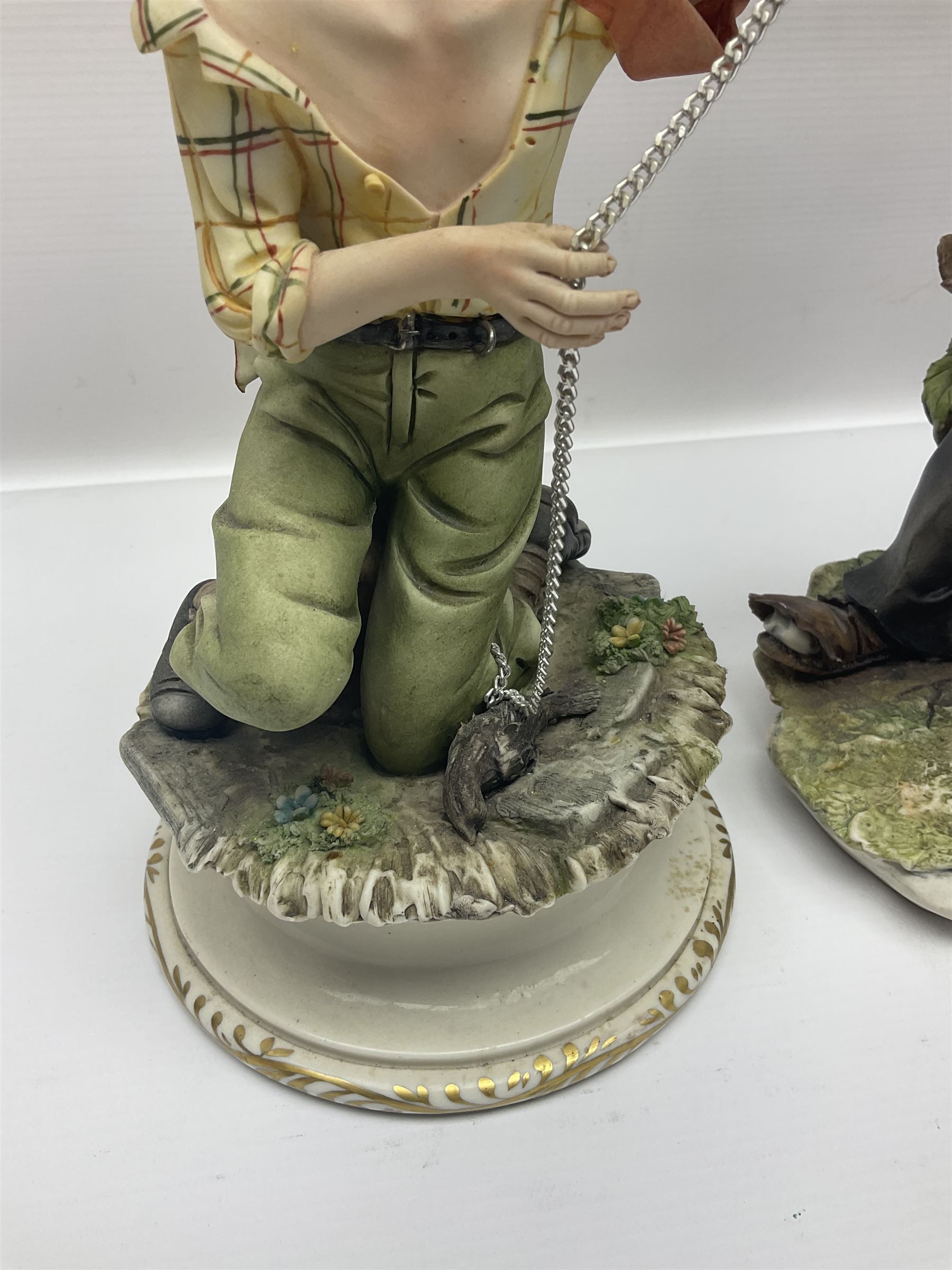 Three Capodimonte figures, to include The Kind Heart Man, modelled by Cortese as a tramp with two doves, The Young Falconer by Maria Angela and another modelled as a tramp darning his socks, all with printed marks, tallest H39cm