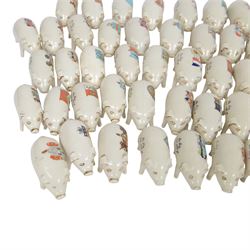 Large collection of Crested Ware pigs, including examples from Southport, Layton, Tottenham Whitby etc 