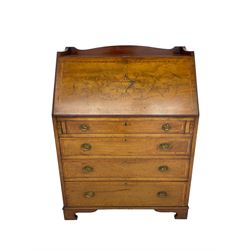 Edwardian inlaid mahogany bureau, shaped raised back, the moulded fall front inlaid with large urn motif and flanked by extending scrolling foliage, interior fitted with correspondence divisions, small drawers and pen and ink stand, with inset leather writing surface, four graduating drawers below, satinwood banding throughout, on bracket feet