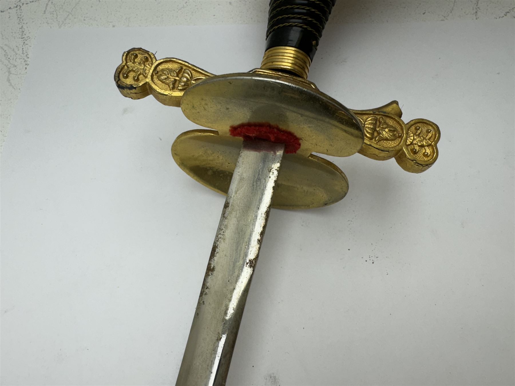 Ceremonial sword, the 75cm blade marked Toledo, Spain, gilt handle with black wire-bound grip  with leather scabbard with gilt tip, L94cm 