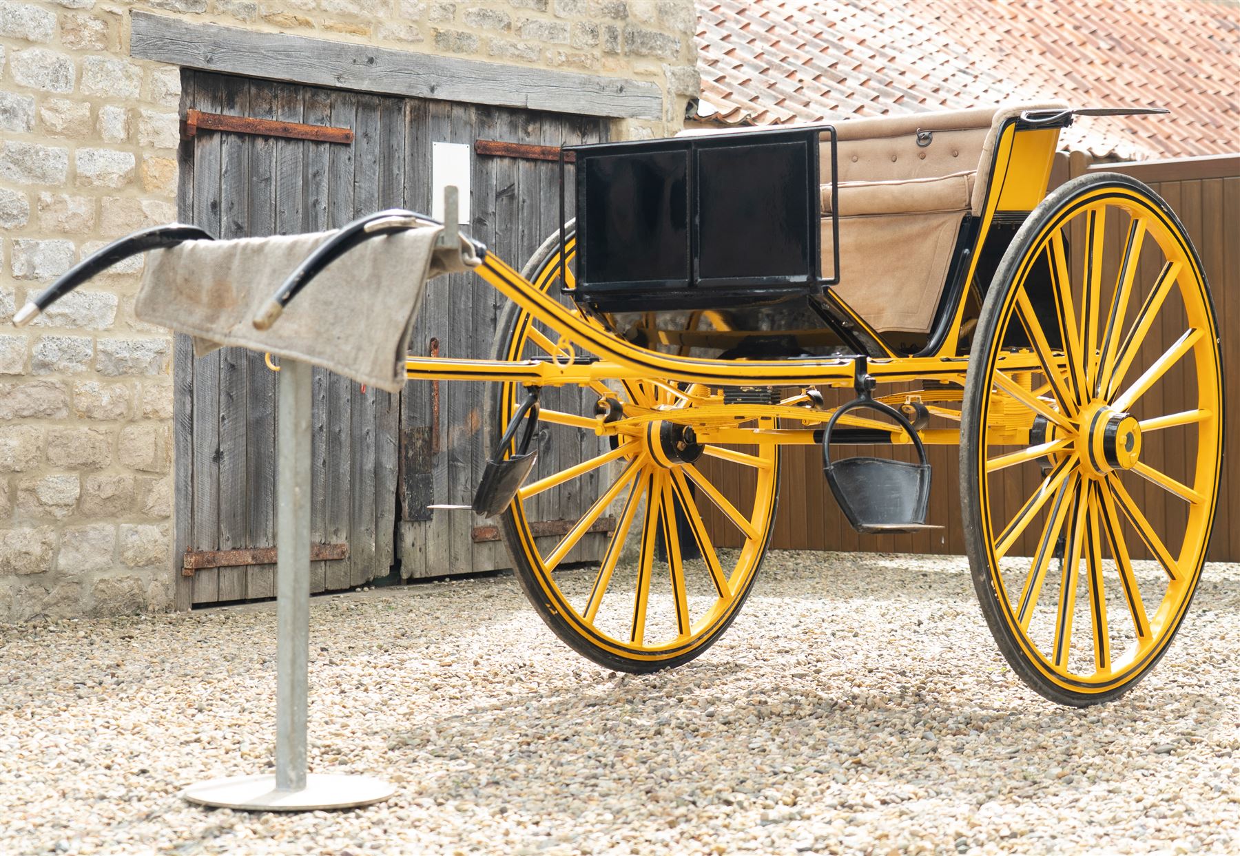 Victorian Two Wheeled Pleasure Driving Round Back Gig by Shanks of London

A Victorian two wheeled pleasure driving round back gig, painted in black and yellow, with upholstered forward facing seat for two, panelled dashboard, wooden spoked wheels, iron step and shafts for a single horse. The vehicle is fitted with a rear luggage compartment and mounted on elliptic springs.

Features
• Black and yellow painted body
• Upholstered forward facing seat
• Panelled dashboard
• Rear luggage compartment
• Wooden spoked wheels
• Iron step
• Elliptic spring suspension
• Shafts for a single horse

Dimensions:
Overall length: 310 cm
Width: 160 cm
Body width: 82 cm
Height: 160 cm

Wheel Diameters:
Wheels: 138 cm

Seating:
Driver and passenger: 2