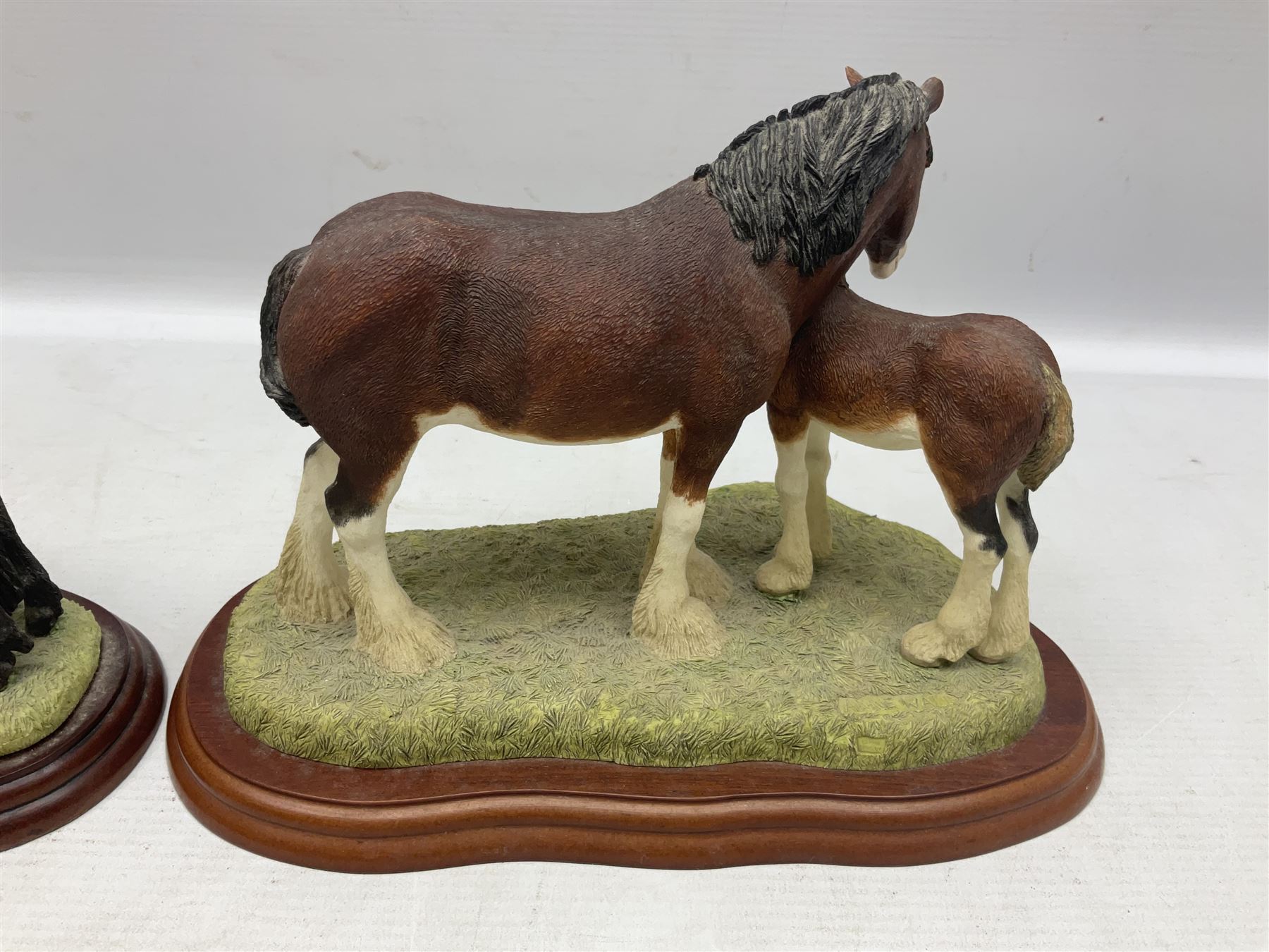 Seven Border Fine Arts figures, comprising Clydesdale Mare & Foal A0187, Highland Mare & Foal A2691 and five horses from the Action Horses series 